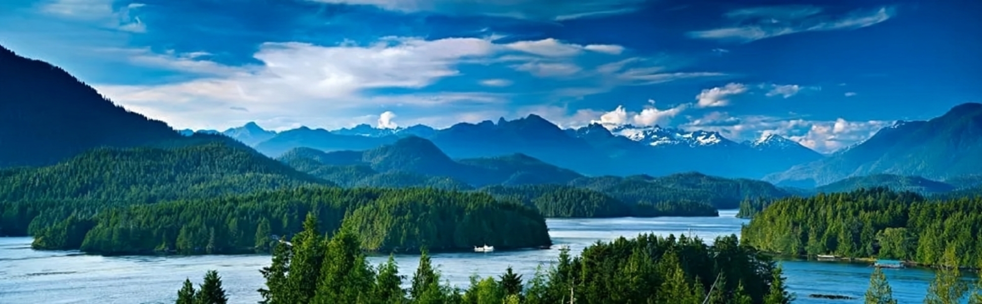 image of a beautiful lake view with clouds mountains and rocks on a lakeshore